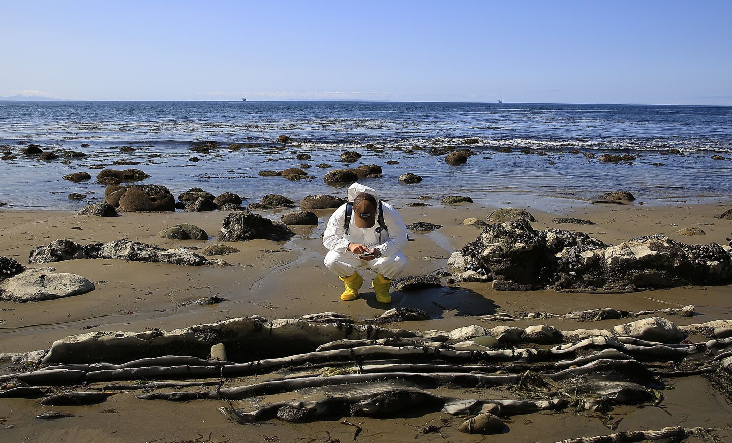 Nicholas Schooler, UCSB Marine Science Institute graduate student conducts natural resource damage assessments in the aftermath of the oil spill on the Gaviota coast.
