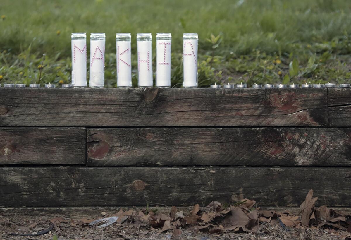 Candles spell out "Ma'Khia" during a community vigil for 16-year-old Ma'Khia Bryant.