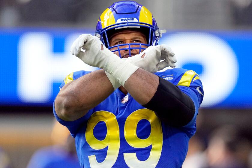 Los Angeles Rams defensive tackle Aaron Donald warms up before an NFL football game against the Arizona Cardinals Sunday, Nov. 13, 2022, in Inglewood, Calif. (AP Photo/Mark J. Terrill)