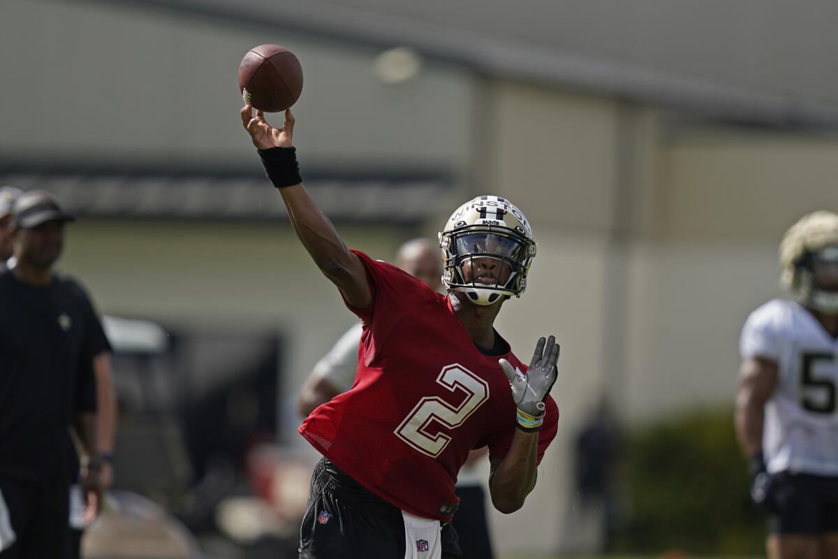 New Orleans Saints quarterback Jameis Winston (20) passes during training camp at their NFL football training facility in Metairie, La., Saturday, July 30, 2022. (AP Photo/Gerald Herbert)
