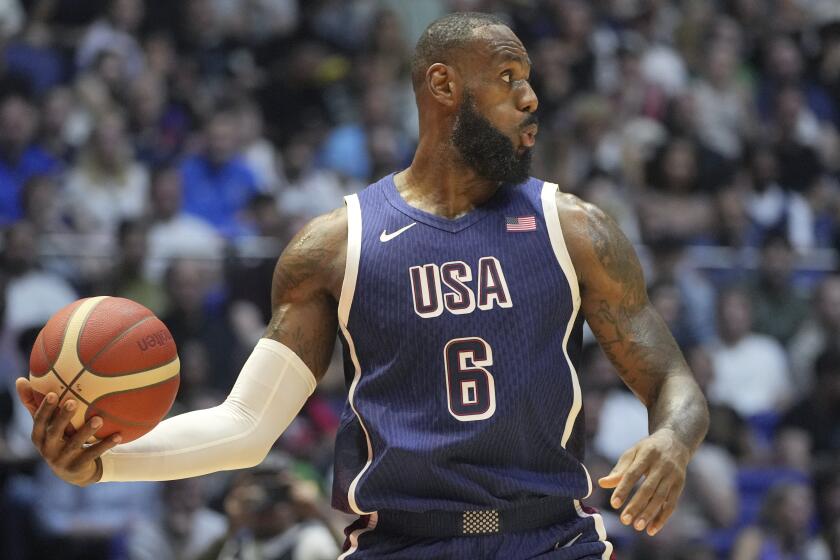 United States' forward LeBron James looks to pass the ball during an exhibition basketball game 