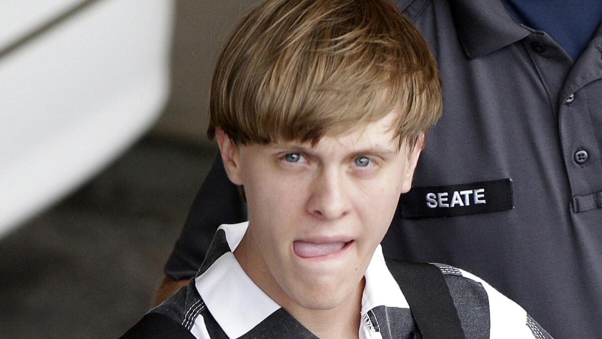 Charleston, S.C., shooting suspect Dylann Roof, shown being escorted from the Cleveland County Courthouse in Shelby, N.C., last week, may have commented on the Daily Stormer, a neo-Nazi website started by Andrew Anglin, 30.