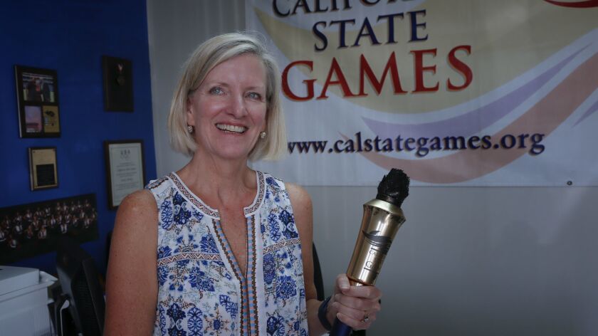 At her office in Point Loma, Sandi Hill, executive director for the California State Games prepares for this year's four-day event involving 24 competitive events in San Diego.