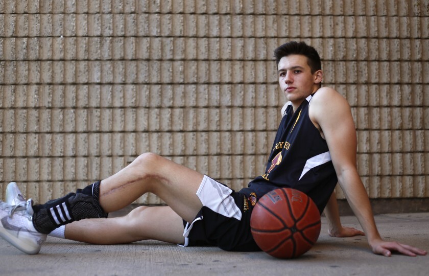 Torrey Pines’ Nick Herrmann, who has a 16-inch scar on his left leg, is shining once again on the basketball courts.