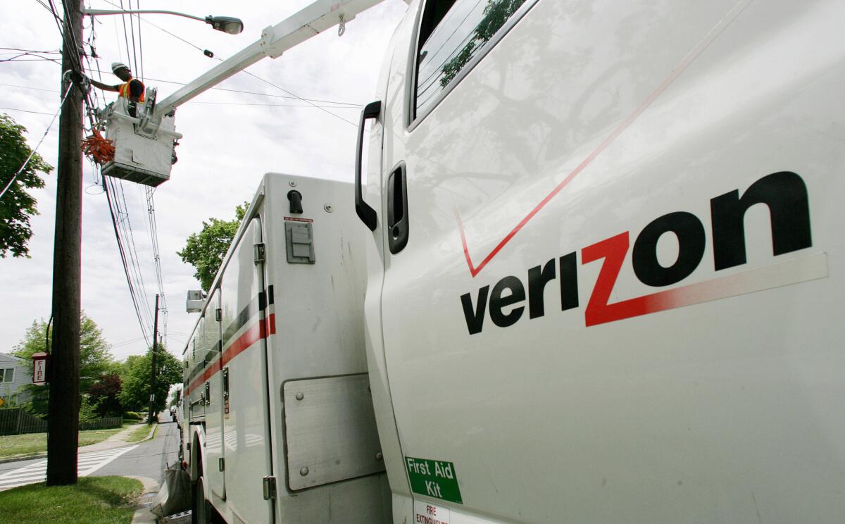 A Verizon technician installs fiber-optic lines in Somerville, N.J., in 2009.