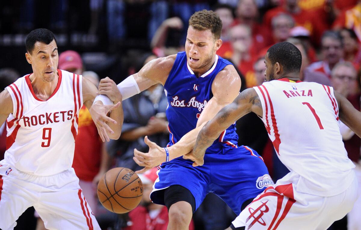 Blake Griffin faces the defense of Houston's Pablo Prigioni, left, and Trevor Ariza during the second round of the playoffs on May 17.