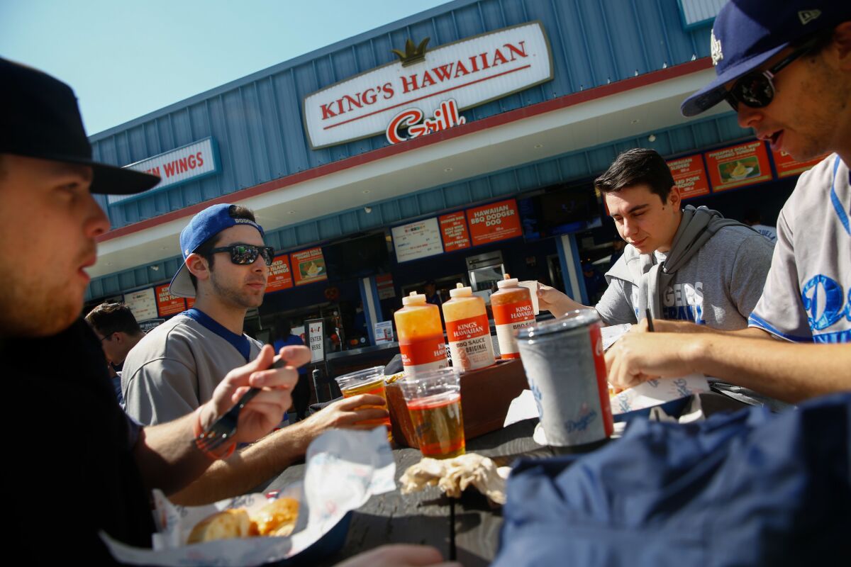 From left: Colyn Rondeau, Jordan Pancer, Nick Spencer and Connley Peterson eat at the King's Hawaiian Grill at Dodger Stadium on May 27.