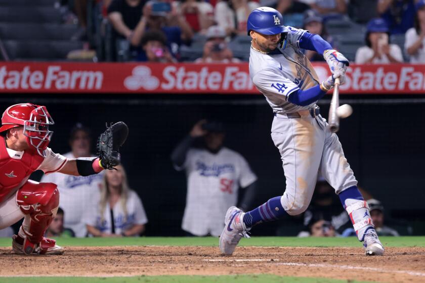 Anaheim, California September 3, 2024-Dodgers Mookie Betts hits a three-run home run against the Angels in the tenth inning at Anaheim Stadium Tuesday. (Wally Skalij/Los Angeles Times)