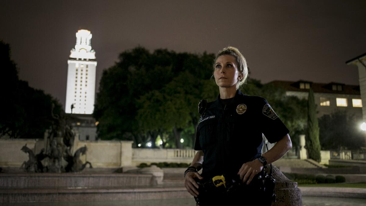 Austin police Officer Monika McCoy near the University of Texas tower, where her father, Houston McCoy was one of the responding officers when sniper Charles Whitman was shot 50 years ago.