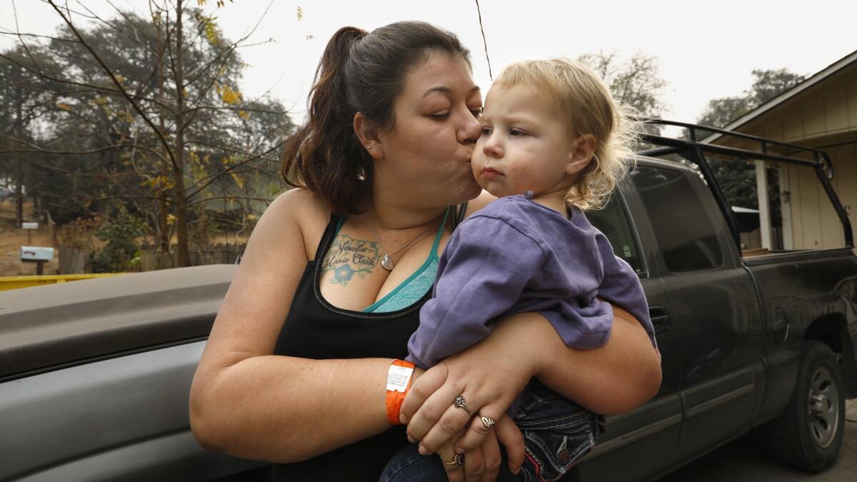 Megan Butler, 26, and her daughters Aurora, 2, and Novalei, 5, (not shown) are homeless after their house burned down in Concow, Calif.