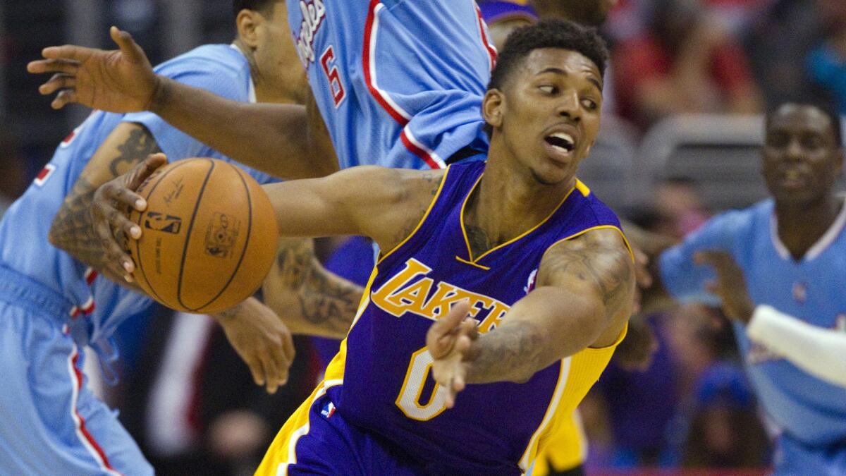 Lakers forward Nick Young cuts back across the key during a game against the Clippers in April 6. The Clippers and Lakers will renew their rivalry on Halloween night.