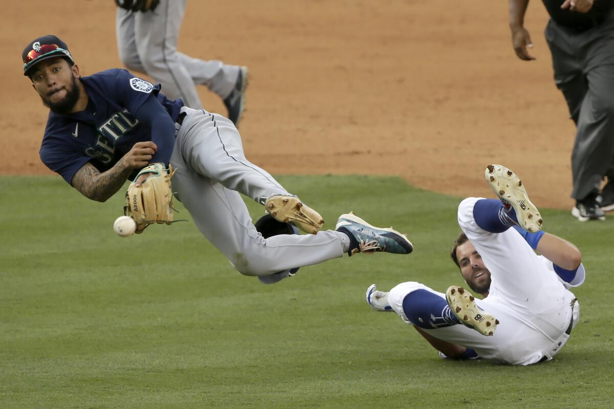 Seattle Mariners shortstop J.P. Crawford throws home after