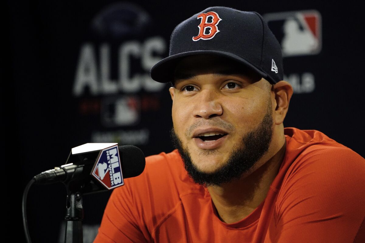 Boston Red Sox Game 3 starting pitcher Eduardo Rodríguez speaks to reporters prior to a baseball practice at Fenway Park, Sunday, Oct. 17, 2021, in Boston. (AP Photo/Robert F. Bukaty)