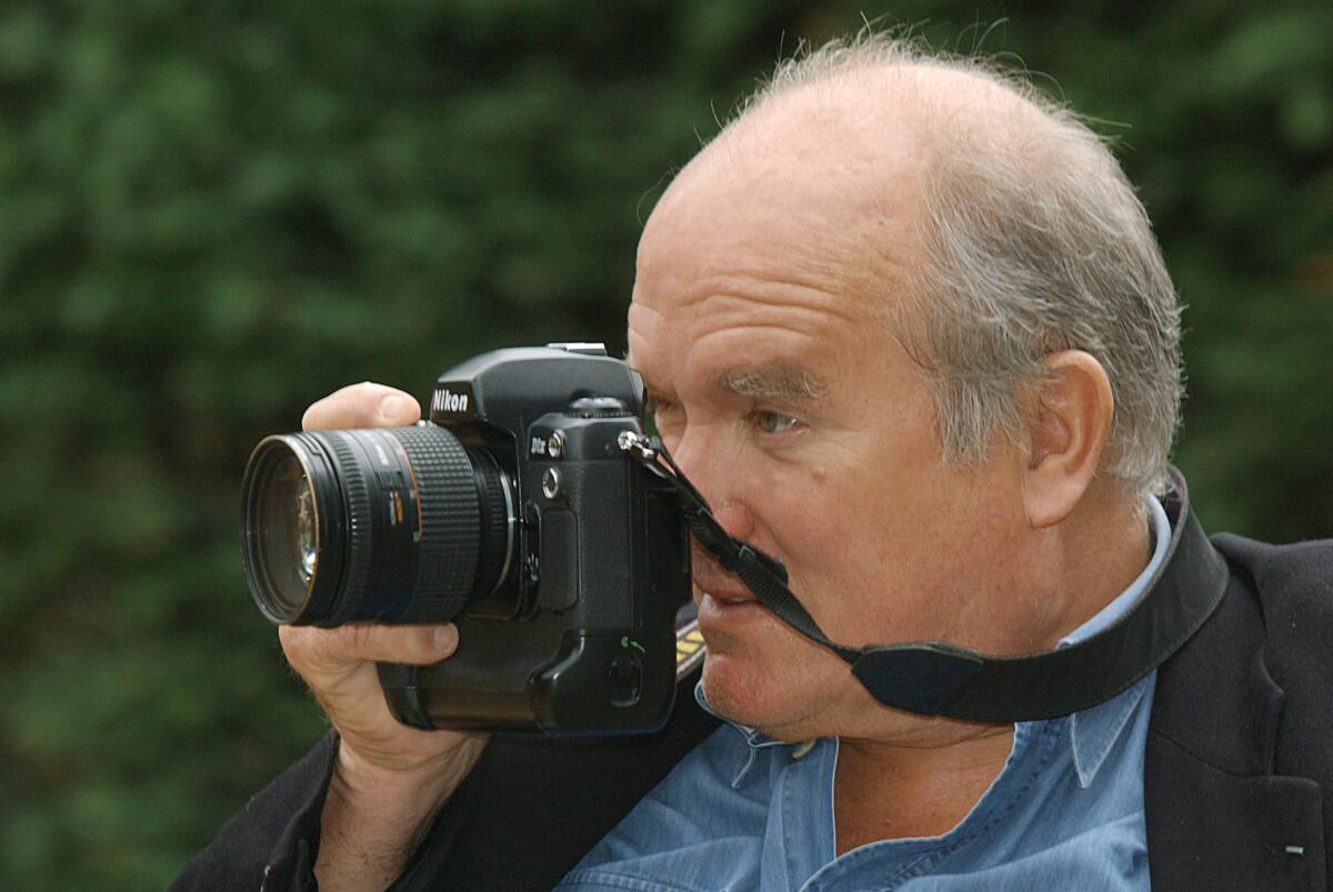 FILE - In this Jan. 18, 2008 file photo, star photographer Peter Lindbergh is taking a picture in Duesseldorf, Germany. The icon fashion photographer died at the age of 74. (Horst Ossinger/dpa via AP)