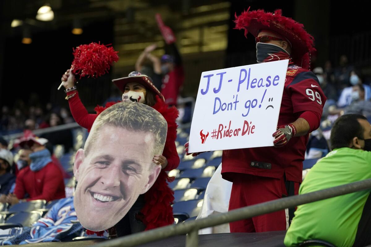 FILE - Houston Texans fans show their support for J.J. Watt (99) during the first half of an NFL football game against the Tennessee Titans in Houston, in this Sunday, Jan. 3, 2021, file photo. It's a sad time for Houston sports fans after multiple superstars have left he city in the last year. (AP Photo/Sam Craft, File)