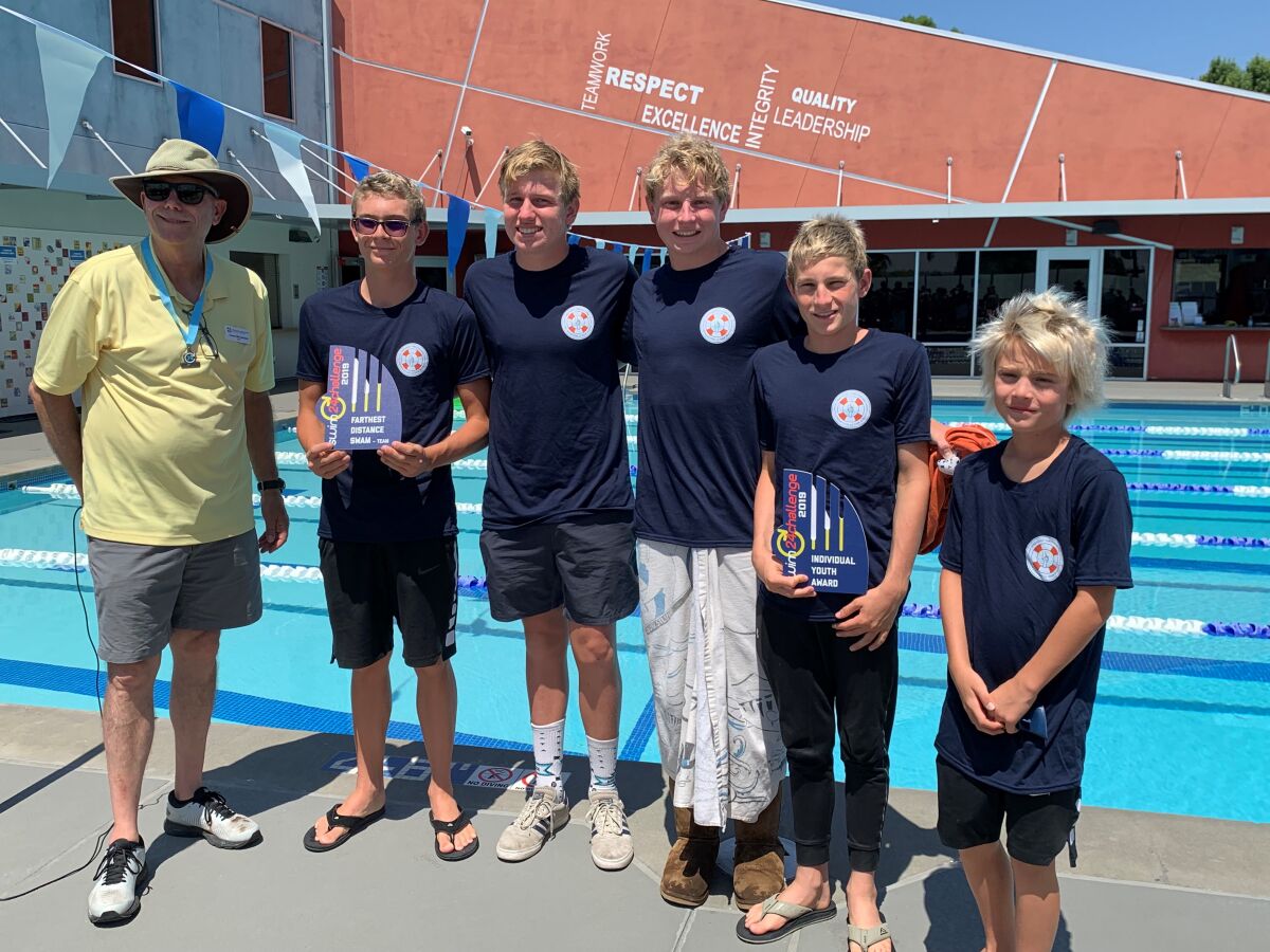 Team Fragomen members accepting awards from Corey McClelland. president and CEO at Prevent Drowning Foundation (left to right): team captain Jacque Wenger, Dylan Mes, Drew Schmidt, Sébastien Wenger, and Lorenzo Wenger.