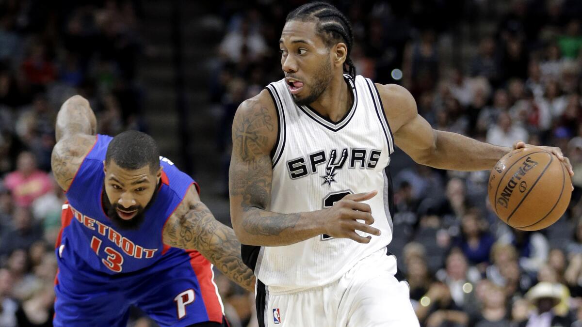 Spurs forward Kawhi Leonard drives around Pistons forward Marcus Morris (13) during the second half Wednesday.