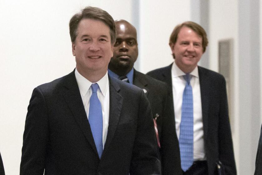 President Donald Trump's Supreme Court nominee, Judge Brett Kavanaugh, arrives to meet with Sen. Chris Coons, D-Del., a member of the Senate Judiciary Committee which will oversee his confirmation, on Capitol Hill in Washington, Thursday, Aug. 23, 2018. White House Counse Don McGahn is at right, rear. (AP Photo/J. Scott Applewhite)