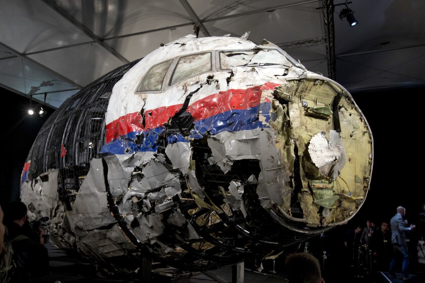 FILE - This Tuesday, Oct. 13, 2015 file photo, shows the reconstructed wreckage of Malaysia Airlines Flight MH17, put on display during a press conference in Gilze-Rijen, central Netherlands. The Netherlands and Ukraine argued Wednesday, Jan. 27, 2022, that a top European court should hear their cases that seek to hold Russia responsible for human rights violations in eastern Ukraine including the 2014 downing of a passenger jet that killed all 298 people on board. (AP Photo/Peter Dejong, File)