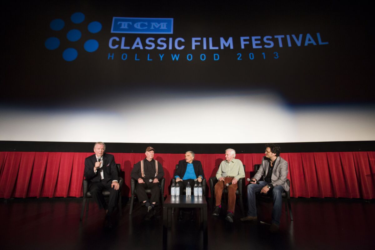 Actors Jon Voight, left, Ned Beatty, Burt Reynolds and director John Boorman speak with TCM host Ben Mankiewicz ahead of a screening of "Deliverance" at the 2013 TCM Classic Film Festival in Hollywood.