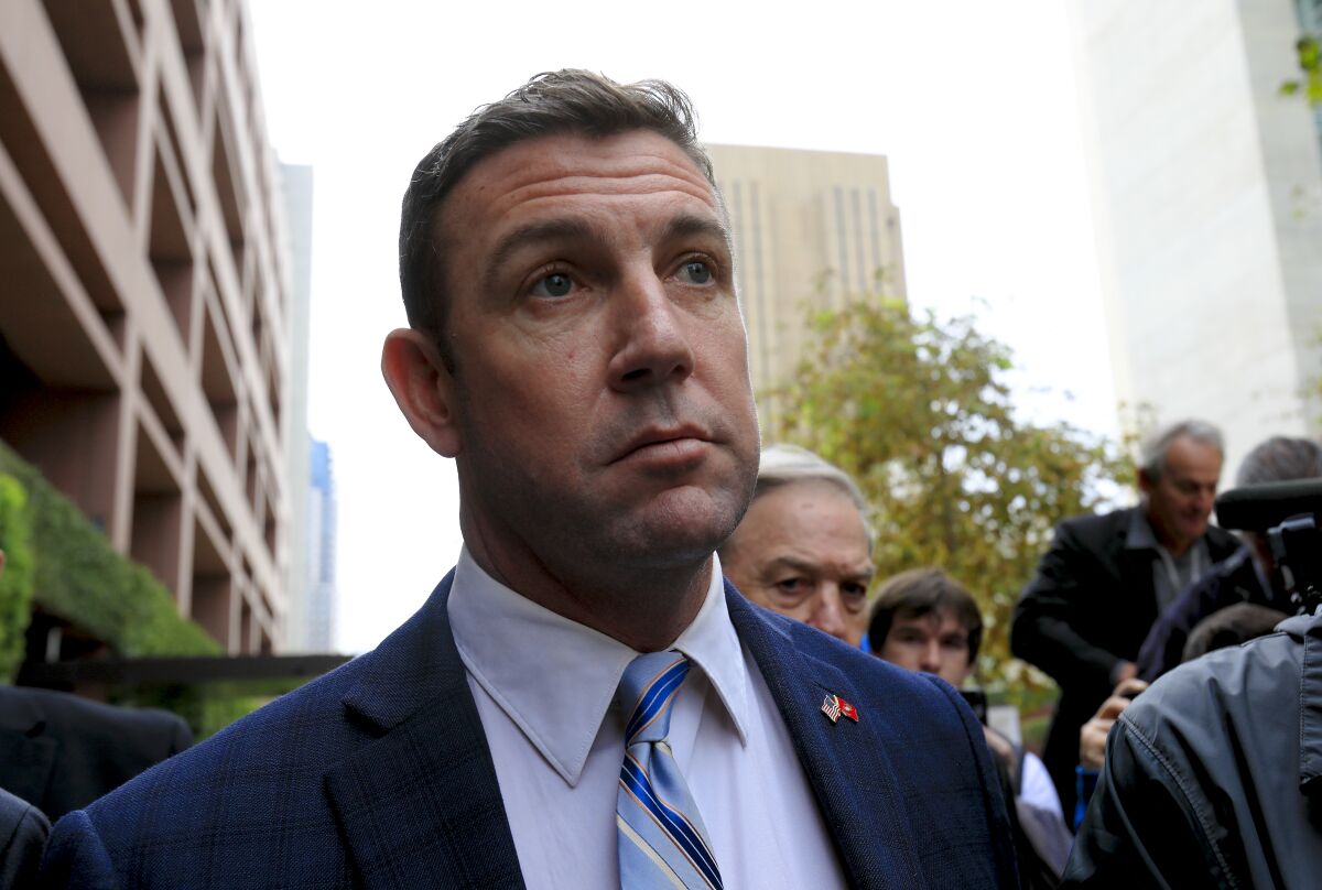 Rep. Duncan Hunter, photographed here outside Federal Court in downtown San Diego after pleading guilty in December, is expected to still receive the congressional portion of his pension.