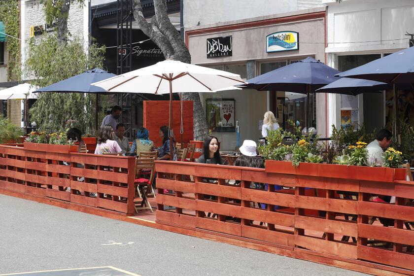 Outdoor dining on newly built decks are one of the new features on the Promenade on Forest in downtown Laguna Beach, which opened to the public on Monday,