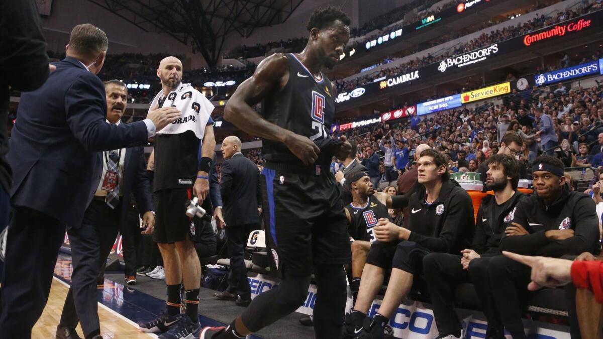 Clippers guard Patrick Beverley is ejected from the game against the Dallas Mavericks for throwing a ball at a fan during the second half on Sunday in Dallas.