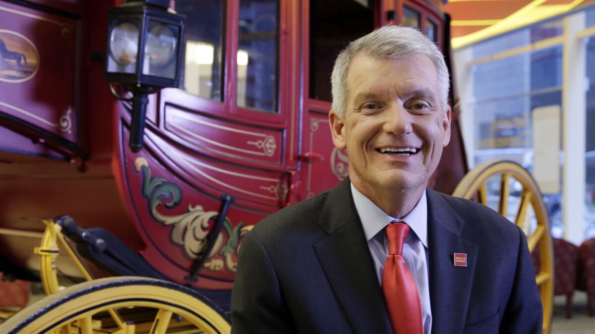 Why is this man smiling? Wells Fargo CEO Timothy Sloan, seen in March 2017.