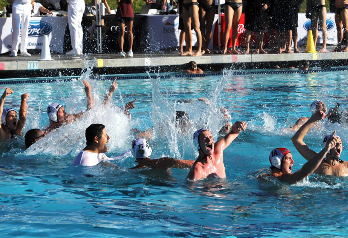 The Newport Harbor High boys' water polo team celebrates after winning the CIF Southern Section Open Division Championship.