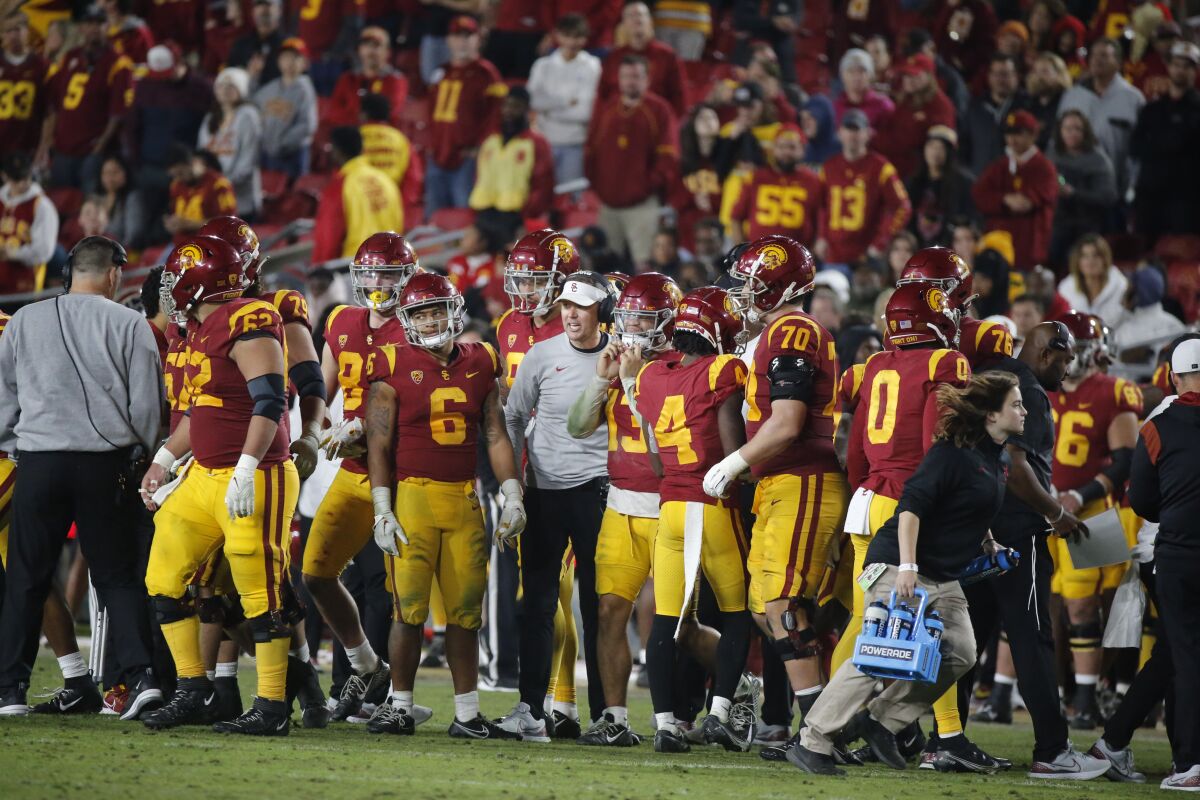 USC coach Lincoln Riley speaks to his players on the sidelines during the fourth quarter against Notre Dame.