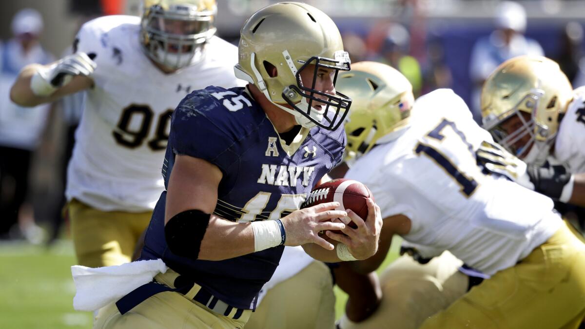 Navy quarterback Will Worth breaks free against Notre Dame for a 60-yard gain during the first half Saturday.