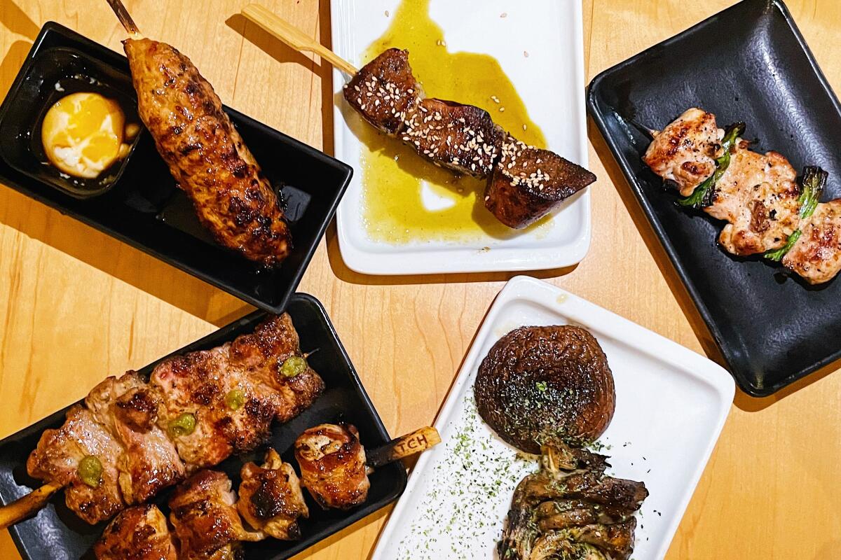 Five plates of assorted yakitori from Hatch in downtown L.A.: tsukune, pork belly, lengua, mushroom and negima.