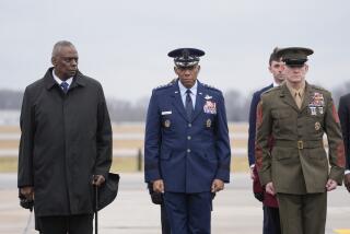 Defense Secretary Lloyd Austin, Chairman of the Joint Chiefs of Staff Gen. CQ Brown and Marine Corp. Sgt. Maj. Troy E. Black watch as an Army carry team moves the flag-draped transfer case containing the remains of U.S. Army Sgt. Kennedy Ladon Sanders, 24, of Waycross, Ga. during a casualty return at Dover Air Force Base, Del., Friday, Feb. 2, 2024. Sanders was killed in a drone attack in Jordan on Jan. 28. (AP Photo/Alex Brandon)