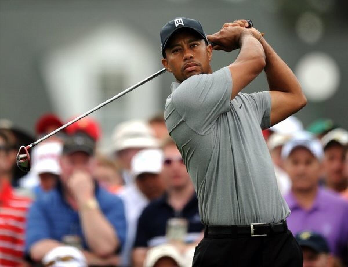 Tiger Woods swings during the first round of the 77th Masters on Thursday in Augusta, Ga.