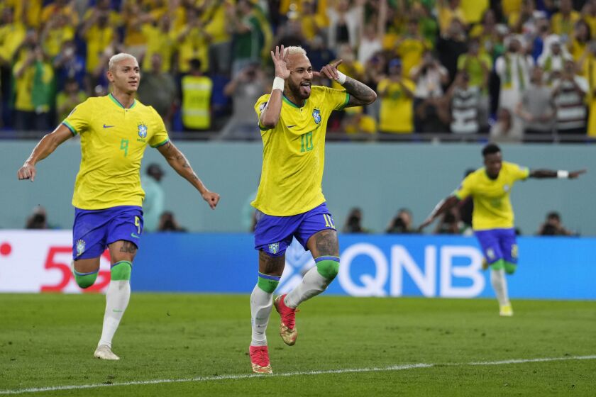 Brazil's Neymar celebrates after scoring his side's second goal during the World Cup round of 16 soccer match between Brazil and South Korea, at the Education City Stadium in Al Rayyan, Qatar, Monday, Dec. 5, 2022. (AP Photo/Manu Fernandez)