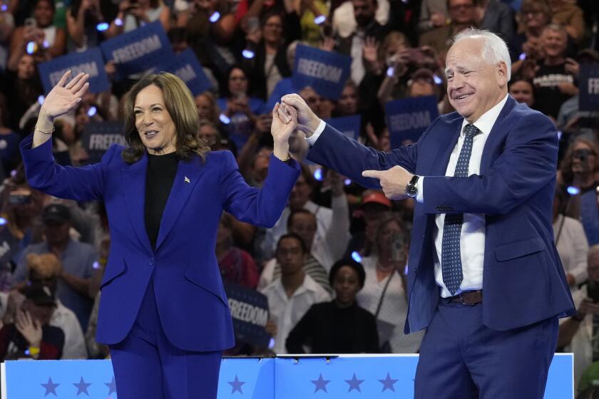 Democratic presidential nominee Vice President Kamala Harris and running mate Minnesota Gov. Tim Walz appear at the Fiserv Forum during a campaign rally in Milwaukee, Tuesday, Aug. 20, 2024. (AP Photo/Jacquelyn Martin)