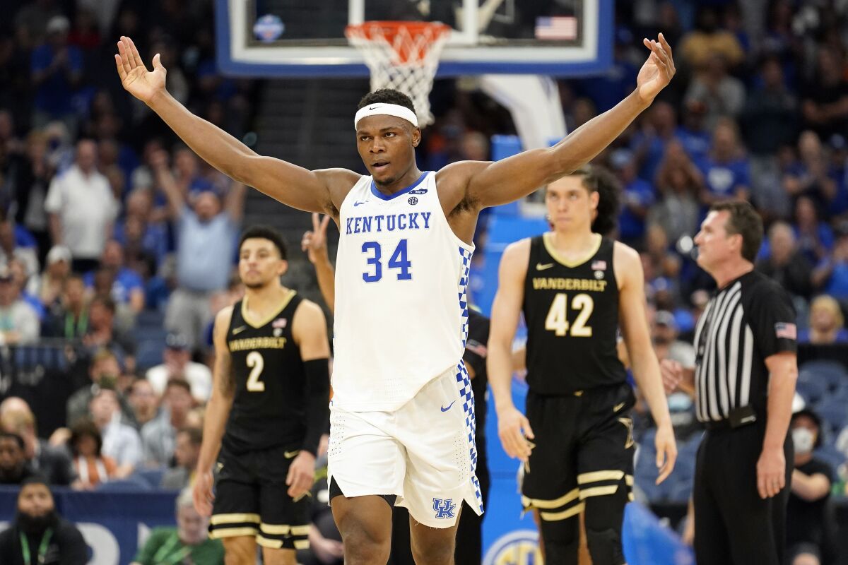 Kentucky forward Oscar Tshiebwe (34) celebrates during the second half of the team's NCAA college basketball game against Vanderbilt in the Southeastern Conference men's tournament Friday, March 11, 2022, in Tampa, Fla. (AP Photo/Chris O'Meara)