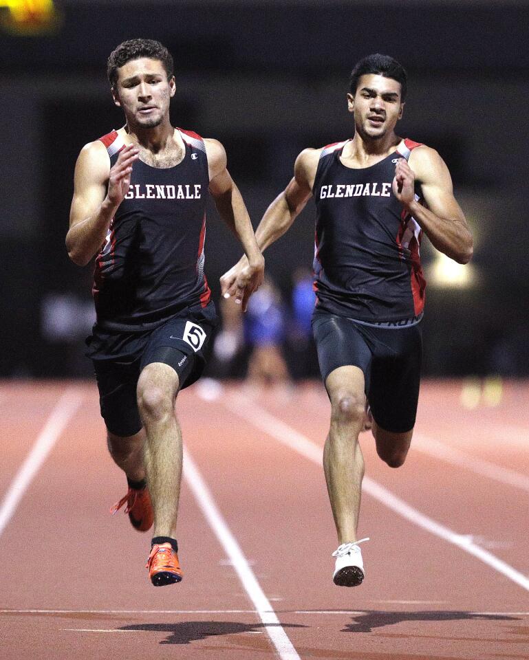 Glendale's Dylan Andrade and Thomas Khan run first and second in the 200 meter dash in a Pacific League track meet at Arcadia High School on Thursday, April 25, 2019.