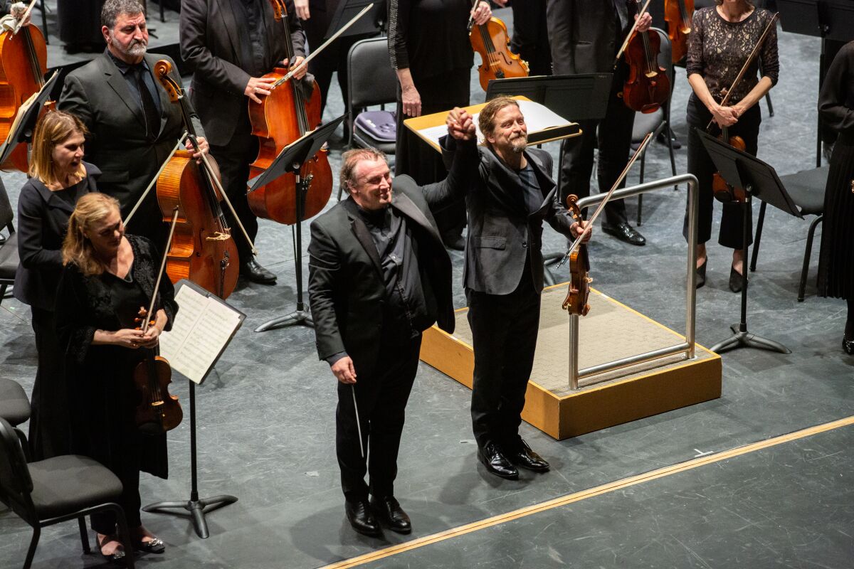 Los Angeles Chamber Orchestra conductor Jaime Martín, left, and violin soloist Christian Tetzlaff on Friday at the Soraya in Northridge.