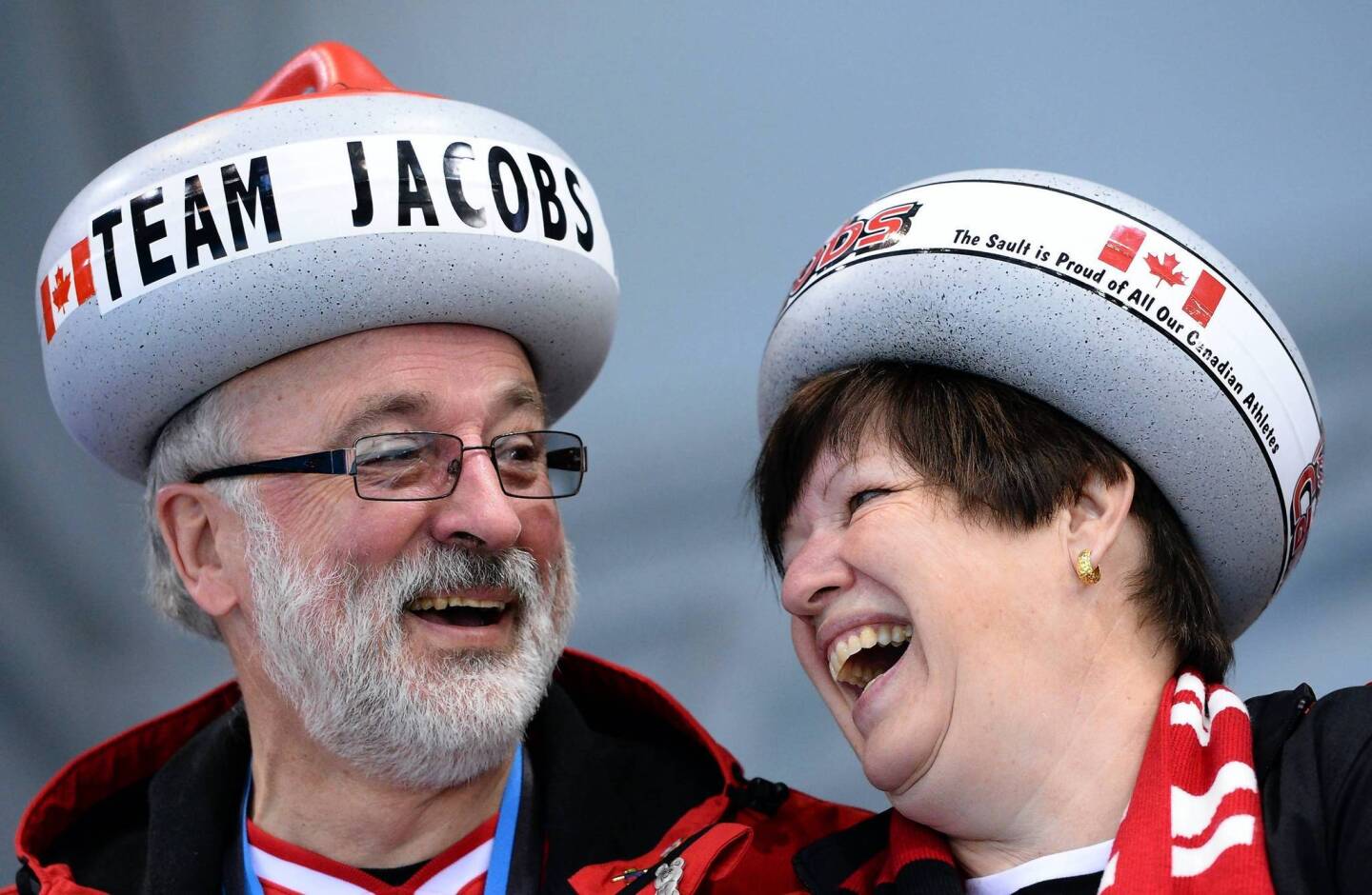 Canada's supporters cheer during the men's curling round robin session 10 at the Ice Cube Curling Center.