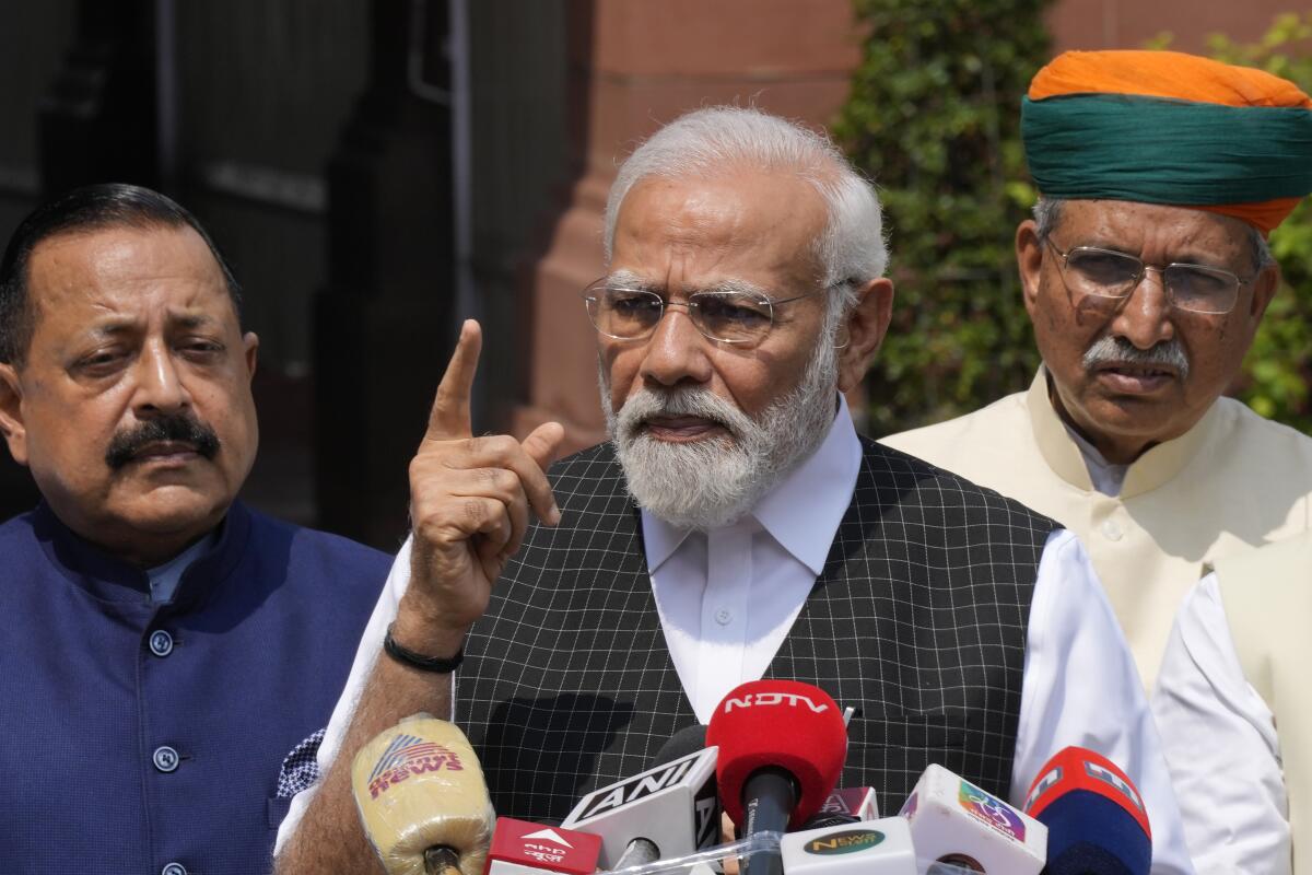 Indian Prime Minister Narendra Modi raising a finger while speaking