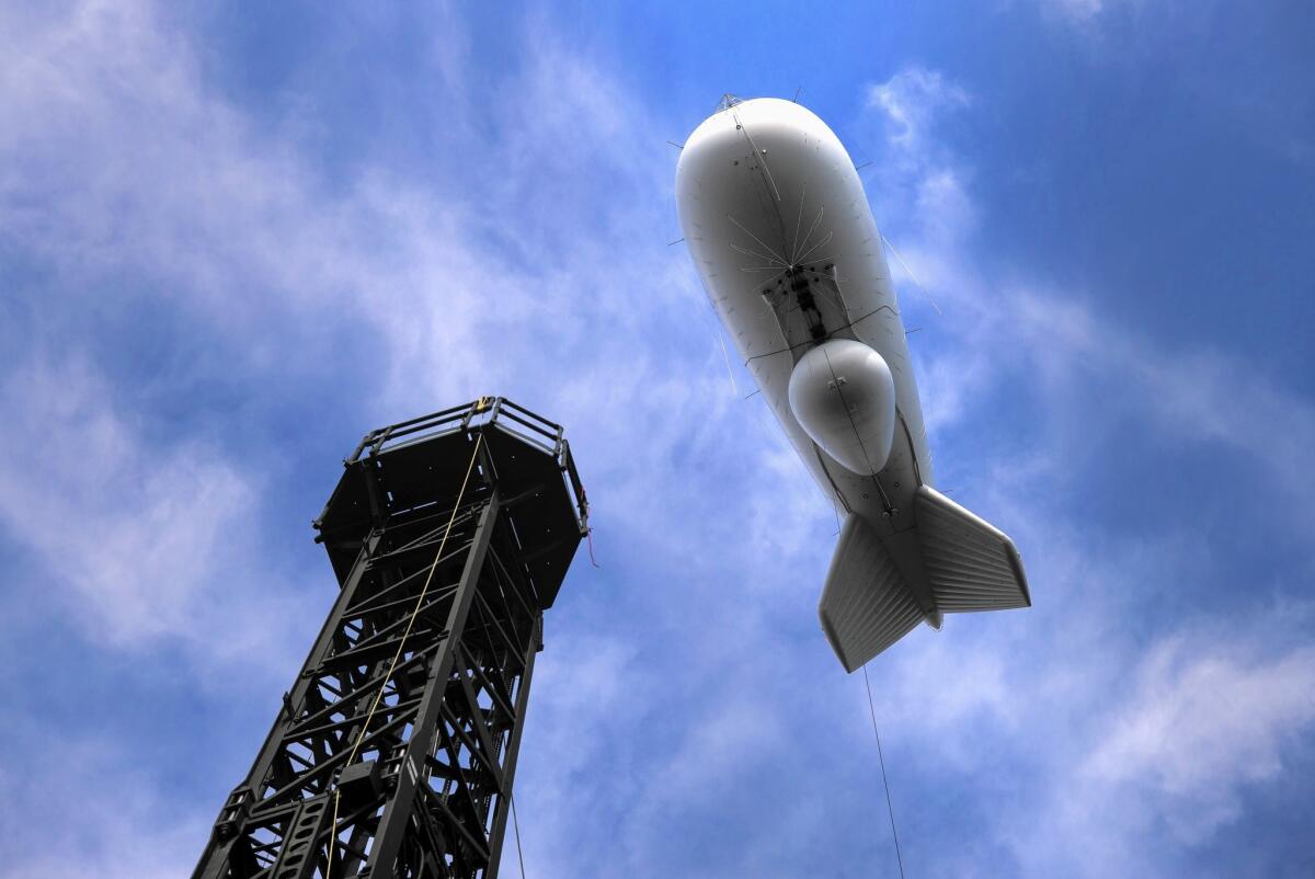 A radar-equipped blimp floats above the Army's Aberdeen Proving Ground in Maryland, where officials are conducting a three-year "operational exercise" of JLENS, a $2.7-billion defense system designed to detect airborne threats.