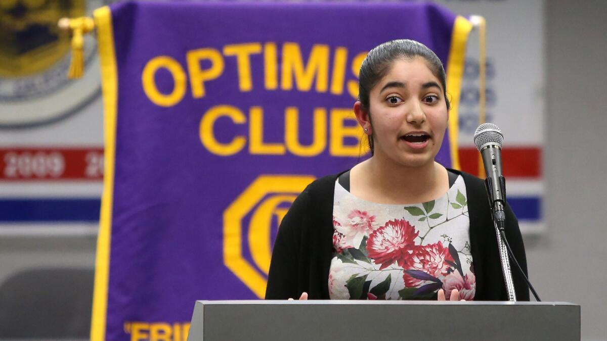 Taniya Khattra takes her turn in speaking during the Surf City Optimist-Ocean View School District Oratorical Contest on Monday.