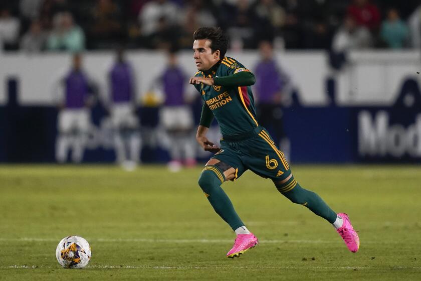 LA Galaxy midfielder Riqui Puig dribbles during the second half of the team's MLS soccer match against Minnesota United, Wednesday, Sept. 20, 2023, in Carson, Calif. (AP Photo/Ryan Sun)