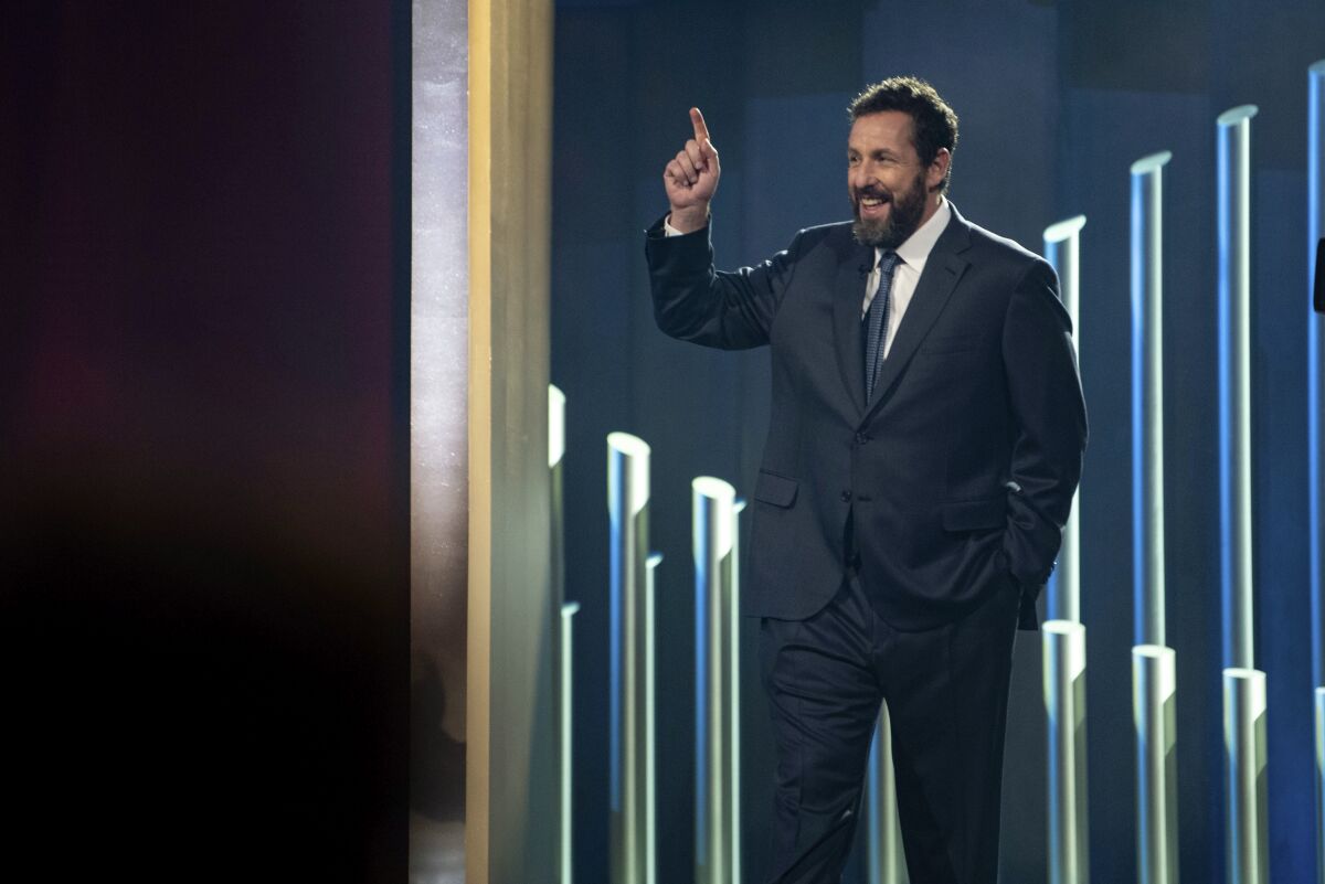 Mark Twain Prize recipient Adam Sandler is introduced at the start of the 24th Annual Mark Twain Prize for American Humor at the Kennedy Center for the Performing Arts on Sunday, March 19, 2023, in Washington. (AP Photo/Kevin Wolf)