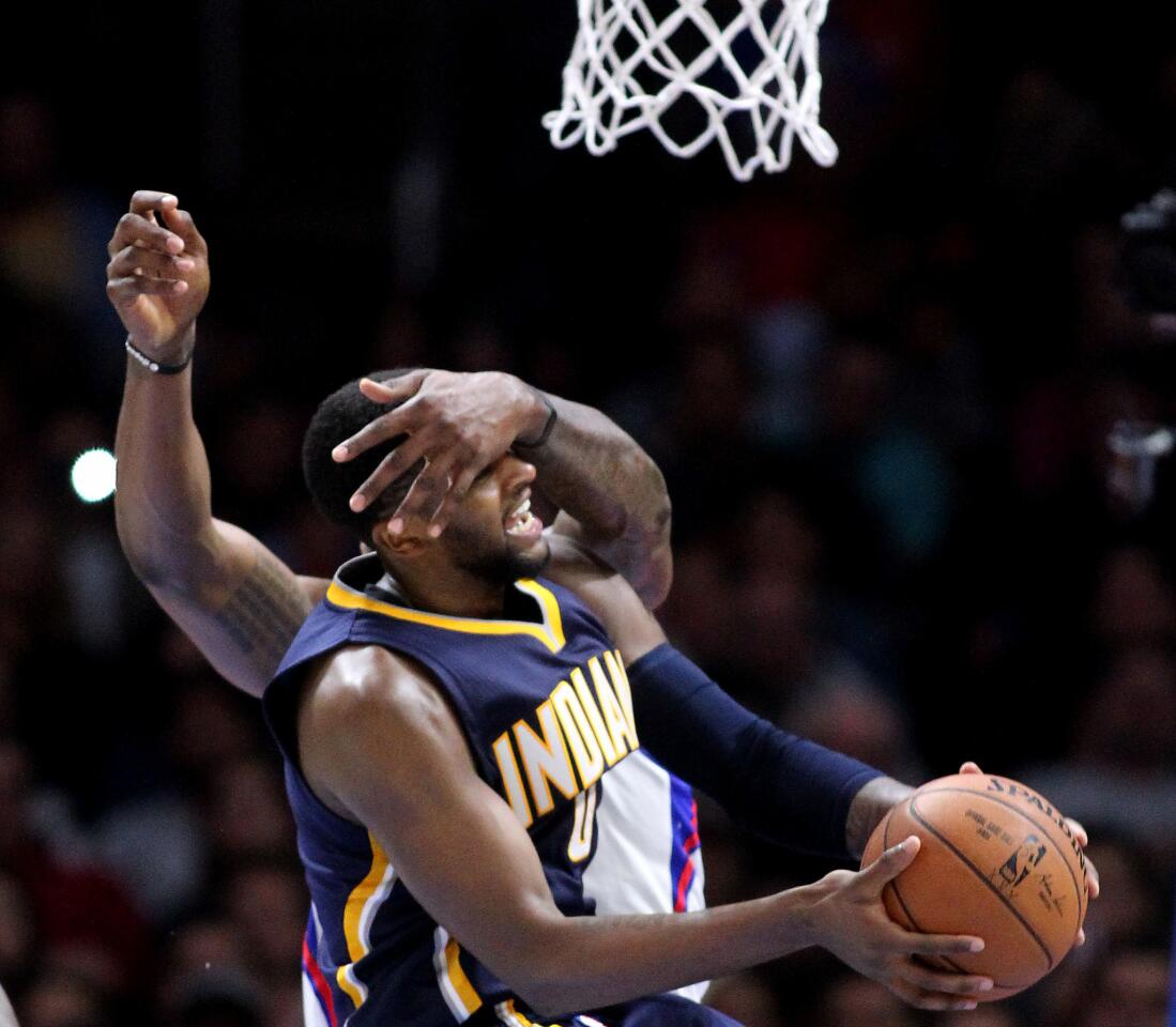 Pacer guard C.J. Miles is fouled by Clippers center DeAndre Jordan while trying to score in the fourth quarter.