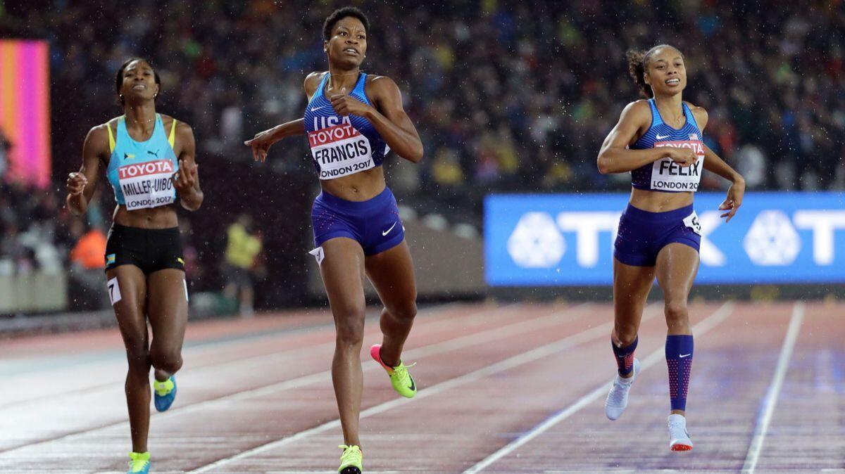 Phyllis Francis, center, crosses the line to win the gold medal in the Women's 400-meter final ahead of Allyson Felix, right, and Shaunae Miller-Uibo during the World Athletics Championships in London on Wednesday.