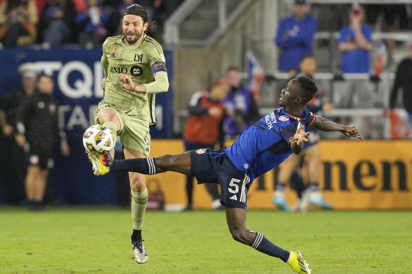 CINCINNATI, OHIO - SEPTEMBER 28: Obinna Nwobodo (R) #5 of FC Cincinnati breaks up a pass to Ilie Sánchez #6 of Los Angeles FC during the second half of a MLS soccer match at TQL Stadium on September 28, 2024 in Cincinnati, Ohio. (Photo by Jeff Dean/Getty Images)