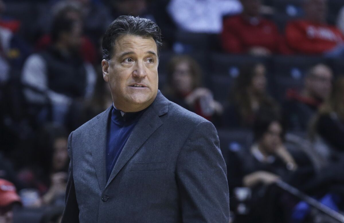 FILE - St. John's coach Steve Lavin walks along the sideline during the first half of the team's NCAA college basketball game against Tulane on Dec. 28, 2014, in New York. Lavin, the former coach at UCLA and St. John's, was hired Wednesday night, April 6, 2022, to take over the program at the University of San Diego. (AP Photo/John Minchillo, File)