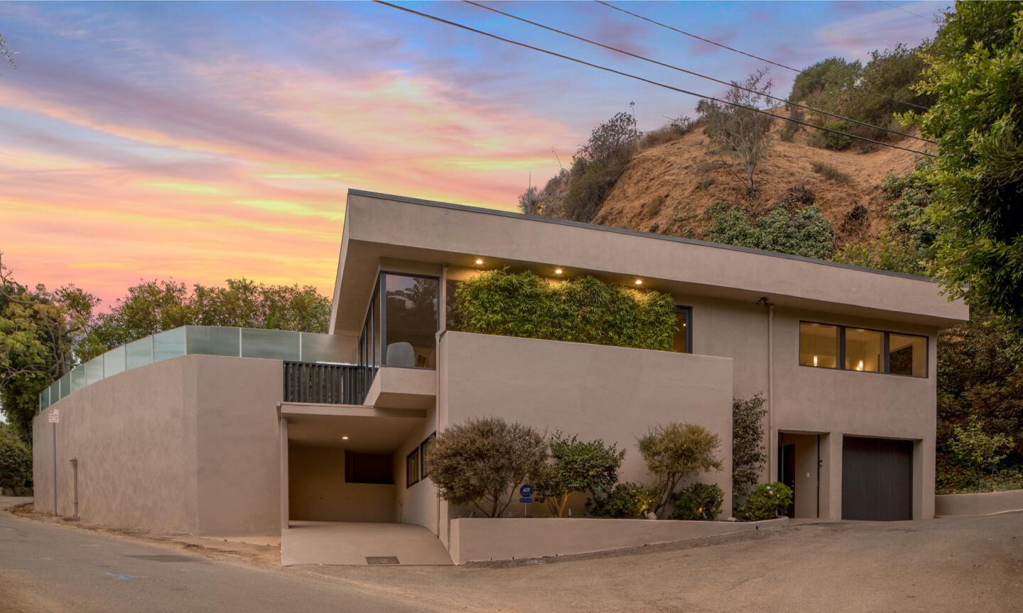 The 1940s home has been updated with gallery white walls and hardwood floors across two stories.